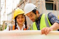 Civil engineers team with safety hard hat working together at construction site outdoor, Construction workers checking Royalty Free Stock Photo