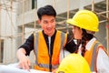 Civil engineers team with safety hard hat working together at construction site outdoor, Construction workers checking Royalty Free Stock Photo
