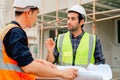 Civil engineers team with safety hard hat working together at construction site outdoor, Construction workers checking Royalty Free Stock Photo