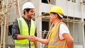 Civil engineers team with safety hard hat working together at construction site outdoor, Construction workers checking Royalty Free Stock Photo