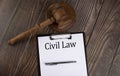 CIVIL LAW text on paper with gavel on wooden background Royalty Free Stock Photo