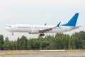 Civil passenger airplane landing runway at international airport Royalty Free Stock Photo