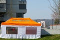 Civil protection at the time of coronavirus, corona crisis. The tent in front of a hospital to inform and orientate the patients