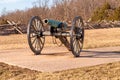 A civil war era cannon in front of a wooden worm fencing at Gettysburg National Military Park Royalty Free Stock Photo