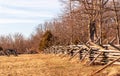 A civil war era cannon next to a wooden worm fencing at Gettysburg National Military Park Royalty Free Stock Photo