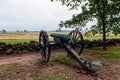 A Civil War era cannon is placed behind a stone wall in Gettysburg, PA - image Royalty Free Stock Photo