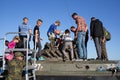 Civilian, children, men, family, sodlier and combatant on armored vehicle