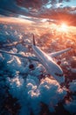 A civilian passenger plane flying above the clouds in the rays of the setting sun. The concept of fast travel, leisure Royalty Free Stock Photo