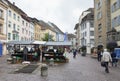 civilian and tourist buy some product in grocery shop on street of middle Zurich old town
