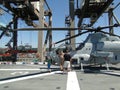 Civilians inspect an AH-1W Super Cobra helicopter