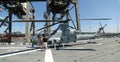 Civilians inspect an AH-1W Super Cobra helicopter