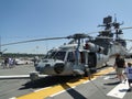 Civilians inspect an SH-60 Seahawk