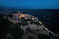 Civita di Bagnoregio. Aerial, night view of ancient Italian city standing on top of a plateau, illuminated by lamps. Famously Royalty Free Stock Photo
