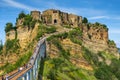 Civita di Bagnoregio, Italy - Panoramic view of historic town of Civita di Bagnoregio with a connecting bridge and surrounding