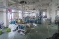 Cixi, China - 04 Sep 2019: Textile cloth sewing factory with dirty space and mess