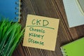 CKD - Chronic Kidney Disease write on sticky notes isolated on Wooden Table