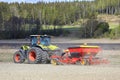 Claas Arion 650 Tractor and Vaderstad Rapid Seed Drill in Field