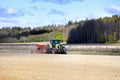 Claas Arion 650 Tractor and Vaderstad Rapid Seed Drill in Field