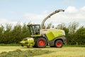 Claas Harvester cutting field Royalty Free Stock Photo