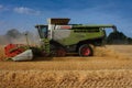 Side View of Combine Harvester Harvesting Barley in Norfolk