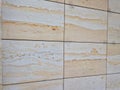 cladding of cut sandstone slabs with iron mapping. public buildings Royalty Free Stock Photo