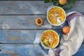 Clafouti with apricots in rameken on blue wooden background. Fruits clafoutis. Sweet casserole. Traditional French cake. Copy