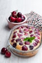 Clafouti cherry pie on rustic wooden table Royalty Free Stock Photo