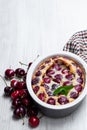 Clafouti cherry pie on rustic wooden table Royalty Free Stock Photo