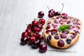 Clafouti cherry pie on rustic wooden table Royalty Free Stock Photo