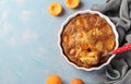 Clafoutis with apricots - delicious French cuisine dessert, Top view Royalty Free Stock Photo