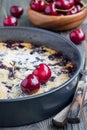 Clafoutis with cherry in baking dish, vertical Royalty Free Stock Photo