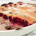 Clafoutis cherry pie - traditional french dessert in a white baking dish Royalty Free Stock Photo
