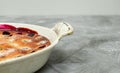 Clafoutis cherry pie - traditional french dessert in a white baking dish Royalty Free Stock Photo