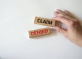 Claim denied symbol. Wooden blocks with words Claim denied. Businessman hand. Beautiful white background. Business and Claim Royalty Free Stock Photo