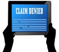 CLAIM DENIED on tablet screen, held by two hands.