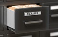 Claims files and documents in cabinet in office. 3D rendered illustration