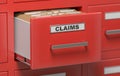Claims files and documents in cabinet in office. 3D rendered illustration