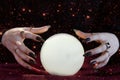 Clairvoyance. Crystal balls hands fortunetellers to have visions. Elements of this image furnished by NASA