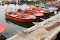 aquaculture boats on pier and some digging tools Royalty Free Stock Photo