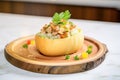 clam chowder in a bread bowl, topped with parsley and oyster crackers Royalty Free Stock Photo