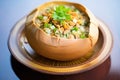 clam chowder in a bread bowl, topped with parsley and oyster crackers Royalty Free Stock Photo