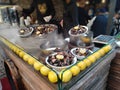 Clam stand with fresh clams and lemons