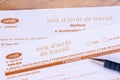 Close-up of an official sick leave form from the French social security