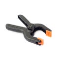 Clamp with orange plastic jaws, isolated over the white background Royalty Free Stock Photo