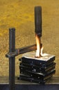 Clamp pressing on burning stack of hard drives