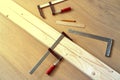 Clamp, slats, pencil and ruler. Concept work with a tree with your own hands Royalty Free Stock Photo