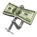 Clamp squeezing dollar currency Royalty Free Stock Photo