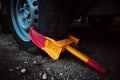 A clamp is used to secure a wheel of the automobile Wheel blocker Booted vehicle Royalty Free Stock Photo
