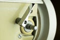 The clamping bar for winding the thread on the spool. Old sewing machine Royalty Free Stock Photo