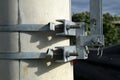 Clamps with fixing bolts on an electric pylon